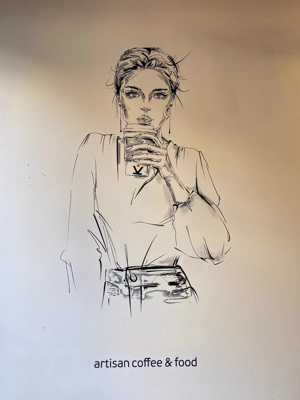 Cafe wall art with fashion illustration and artisan coffee branding by InnoPrint KSA
